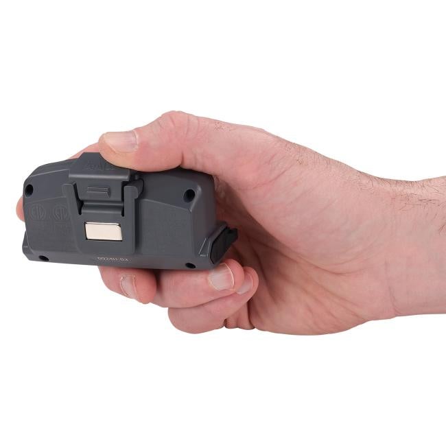 Hand holding a hard hat power bank with clip