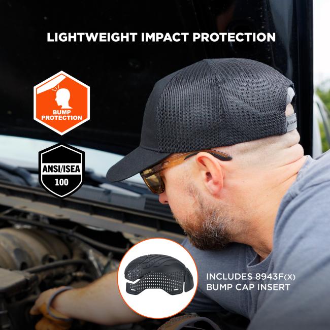 Man in black mesh baseball cap and safety glasses leaning over a vehicle engine; orange bump protection icon and ANSI/ISEA shield visible