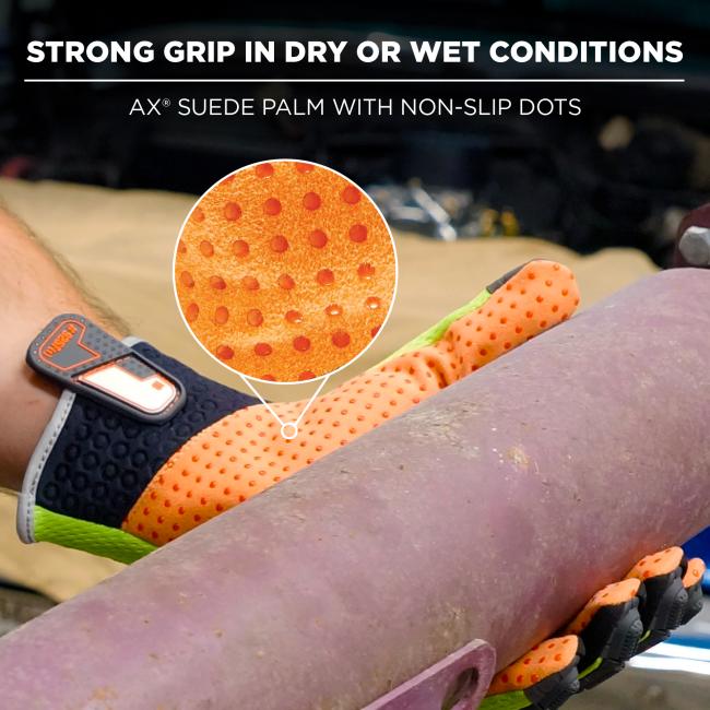 Close-up of an orange dotted suede glove palm with raised non-slip dots, magnified circular inset and a black wrist strap with clip.