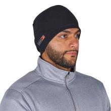 Close-up of a man's lower face and neck wearing a black beanie with a small rectangular label and a gray zip-up jacket.
