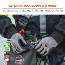 Exterior tool loops and d-rings: For securing tools and attaching tool lanyards. Icons on bottom say D-ring weight rating: 5lbs (2.3 kg). ANSI/ISEA 121.