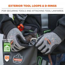 Exterior tool loops and d-rings: For securing tools and attaching tool lanyards. Icons on bottom say D-ring weight rating: 5lbs (2.3 kg). ANSI/ISEA 121.