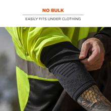 No bulk: easily fits under clothing. Image shows construction worker putting on under clothing. 
