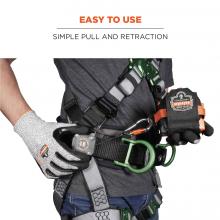 Easy to use: simple pull and retraction. Image shows person pulling attached tape measure from lanyard attached to their harness