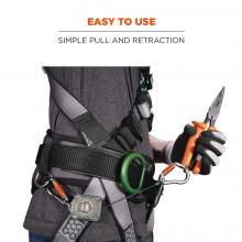 Easy to use: simple pull and retraction. Image shows person pulling attached tape measure from lanyard attached to their harness. 