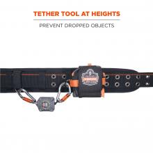 Tether tools at heights: prevent dropped objects. Image shows lanyard and tape measure attached to tool belt. 