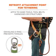 Retrofit attachment point for tethering: affix to hand tools, tool belts, harnesses or structures. Image shows detail of worker anchoring tool tail to harness. Image shows detail of D-ring and text says “swiveling d-ring prevents tangles — 360 degrees”. ANSI/ISEA 121 compliant