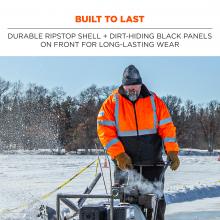 Built to last: durable ripstop shell + dirt-hiding black panels on front for long-lasting wear. Image is man in jacket using snowblower. 