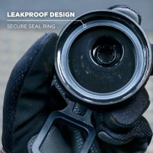 Close-up of circular black opening with white seal ring held in a gloved hand; white text "LEAKPROOF DESIGN" and "SECURE SEAL RING" at top left.