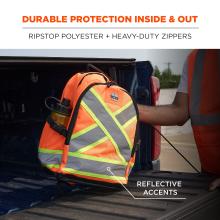 Bright orange high-visibility backpack with gray reflective and neon-yellow X accents in a pickup truck bed, partial person in orange safety vest.
