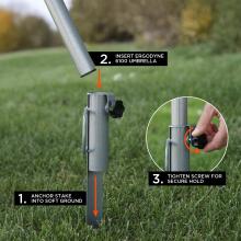 Silver metal pole being inserted into a matching ground stake set in grass; inset shows a hand turning a black tightening knob.