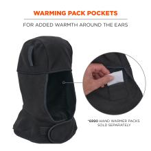 Black fleece hood with ear-warming pocket and Velcro strap; hand inserting small rectangular white warming pack into an interior pocket