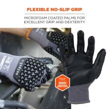 Pair of gray knit gloves with black microfoam-coated palms and textured anti-slip pads, one palm facing viewer and orange abrasion-resistance badge