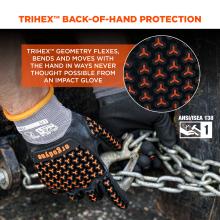 Close-up of hands wearing black gloves with orange tri-arm textured grips holding metal chains and a metal hook