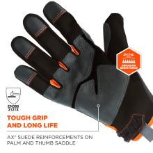 Close-up of black and gray glove with orange stitching, suede reinforcements, orange pull loops and an orange "abrasion resistance" hexagon badge