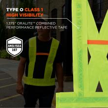 Person wearing neon yellow high-visibility vest with reflective tape; large close-up of neon vest panel and safety badge visible