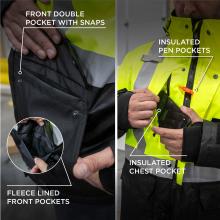 Close-up of neon yellow jacket with gray reflective stripes; black fleece-lined pocket, hands holding phone and orange pen clipped to chest.