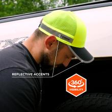 Bearded man in profile wearing neon yellow mesh cap with gray reflective band and dark visor, head tilted downward
