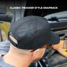 Rear of person's head wearing black mesh cap with adjustable snapback strap and sunglasses hooked at ear