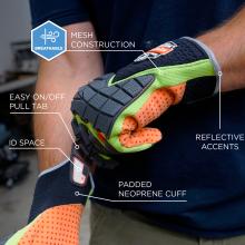Close-up of person wearing neon green and orange padded gloves with black textured rubber grip, perforated orange lining and reflective trim