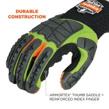 Close-up of green and black protective glove with gray segmented rubber finger and knuckle guards, orange accents, and "DURABLE CONSTRUCTION" text