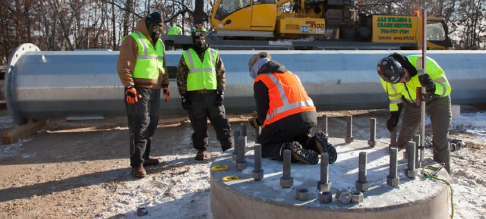 Workers in hi vis vests