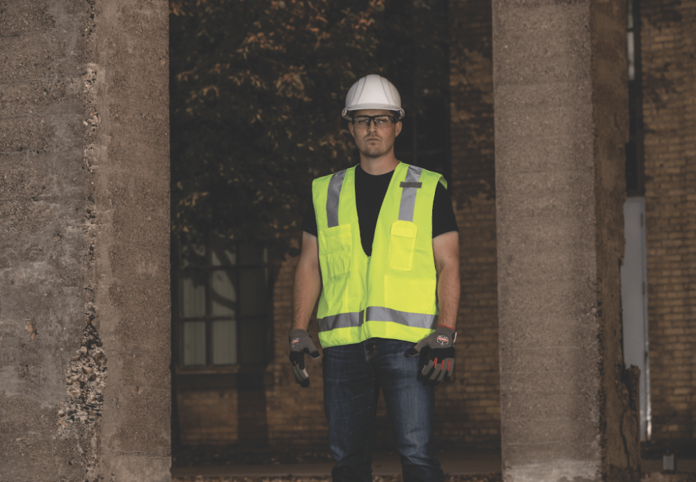 Worker at night with new, brightly reflective hi vis gear