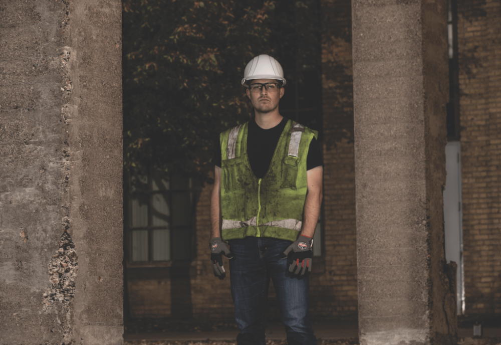 Worker at night wearing dirty, poorly reflective hi vis vest