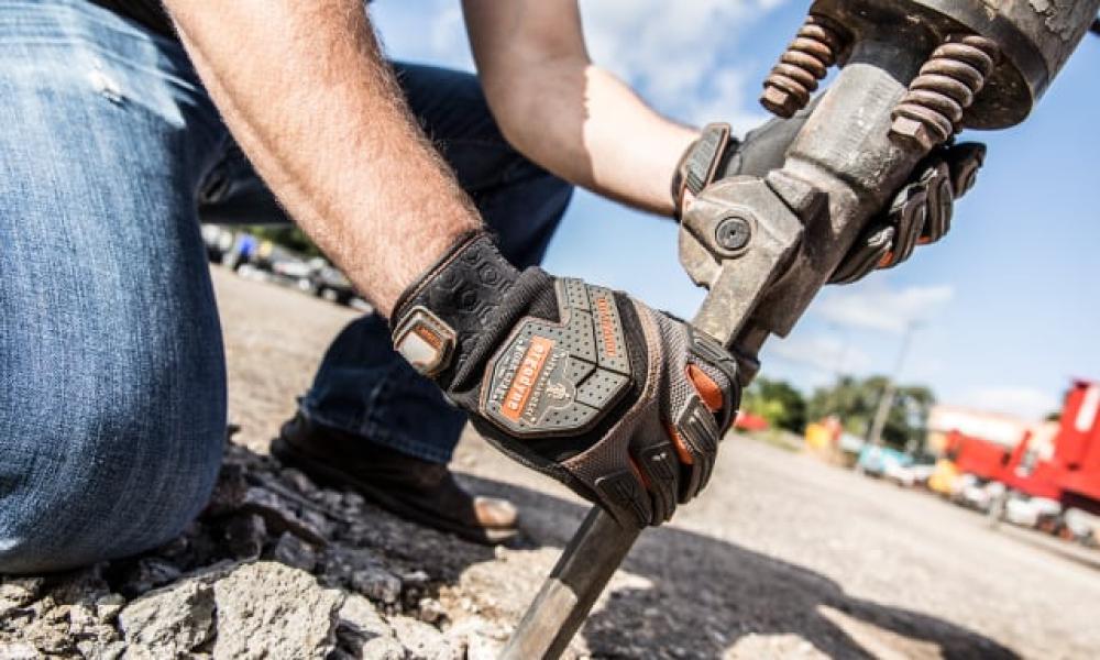 Fixing the road with branded Ergo gloves on