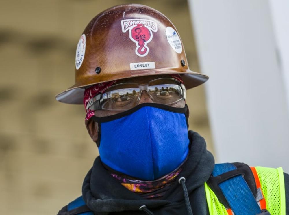 Blue mask on worker
