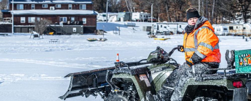 Person on four wheeler in winter