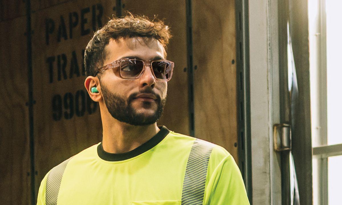 Worker wearing photochromic lens safety glasses