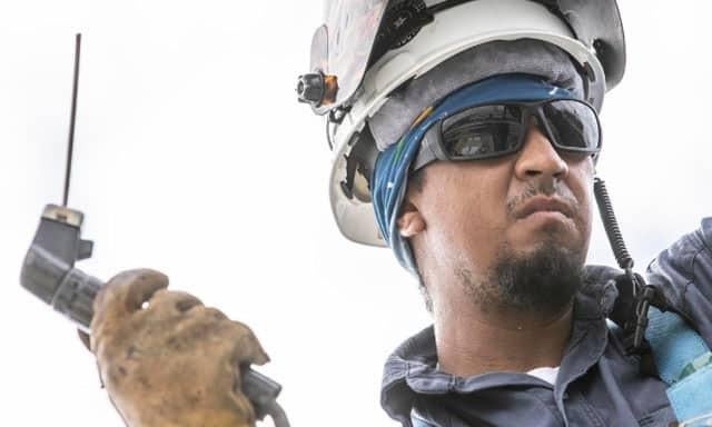 Worker wearing safety glasses