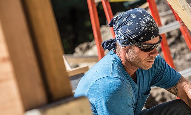 Worker wearing safety glasses