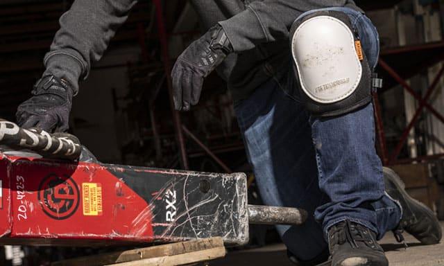 Worker kneeling on knee pad