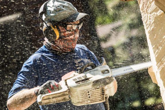 Wood worker wearing eye protection