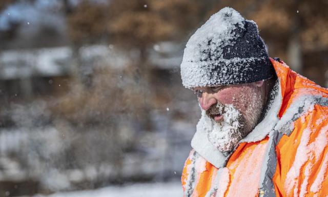 Person with frozen beard & hat